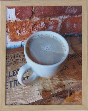 Coffee in front of Brick Wall